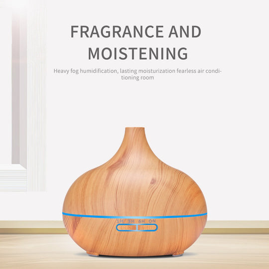 Grain ultrasonic aroma diffuser in dark wood finish, featuring mist settings and ambient light options.