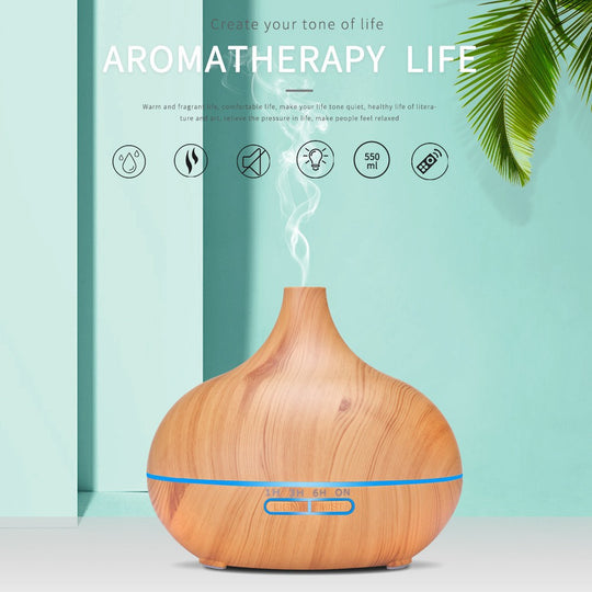 Grain ultrasonic aroma diffuser in dark wood finish, featuring mist settings and ambient light options.