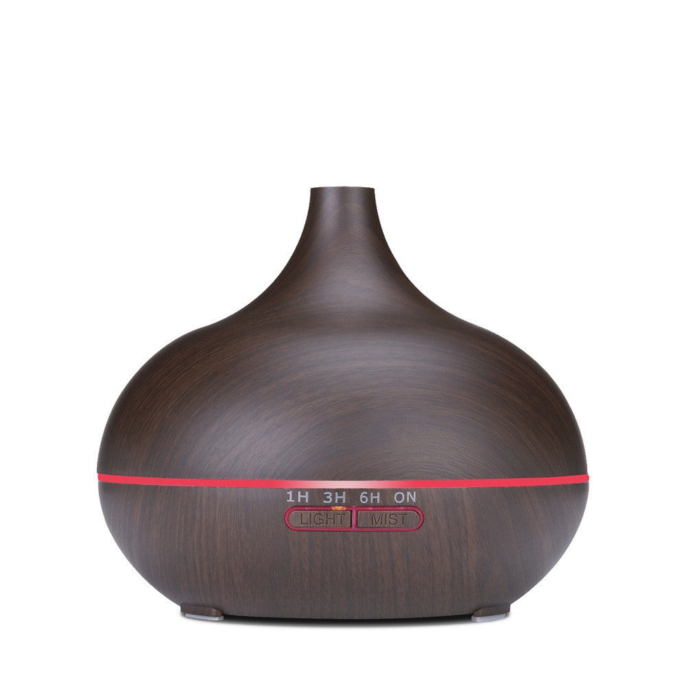 Grain ultrasonic aroma diffuser in dark wood finish, featuring mist settings and ambient light options.